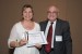 Dr. Nagib Callaos, General Chair, giving Dr. Ruth Bergman two awards: 1) in appreciation for delivering a Plenary Keynote Address on “Why is knowledge like an iceberg?” and 2) the best paper award certificate of the session "Collaborative Enterprises." The title of the awarded paper is "Emerging “Living” Communities - Scalability of Knowledge Transfer in Complex Systems."